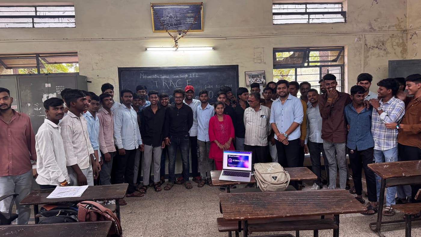 A group of students and facilitators posing together after an AI Literacy Series session at an ITI, with a laptop displaying the QriusAI Foundation branding in the foreground.