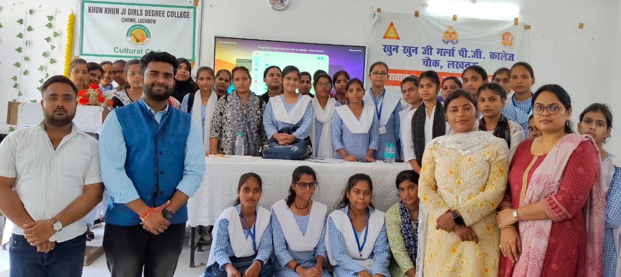 Students and facilitators posing in front of a presentation screen during an AI literacy session at Khun Khun Ji Girls Degree College, Lucknow.